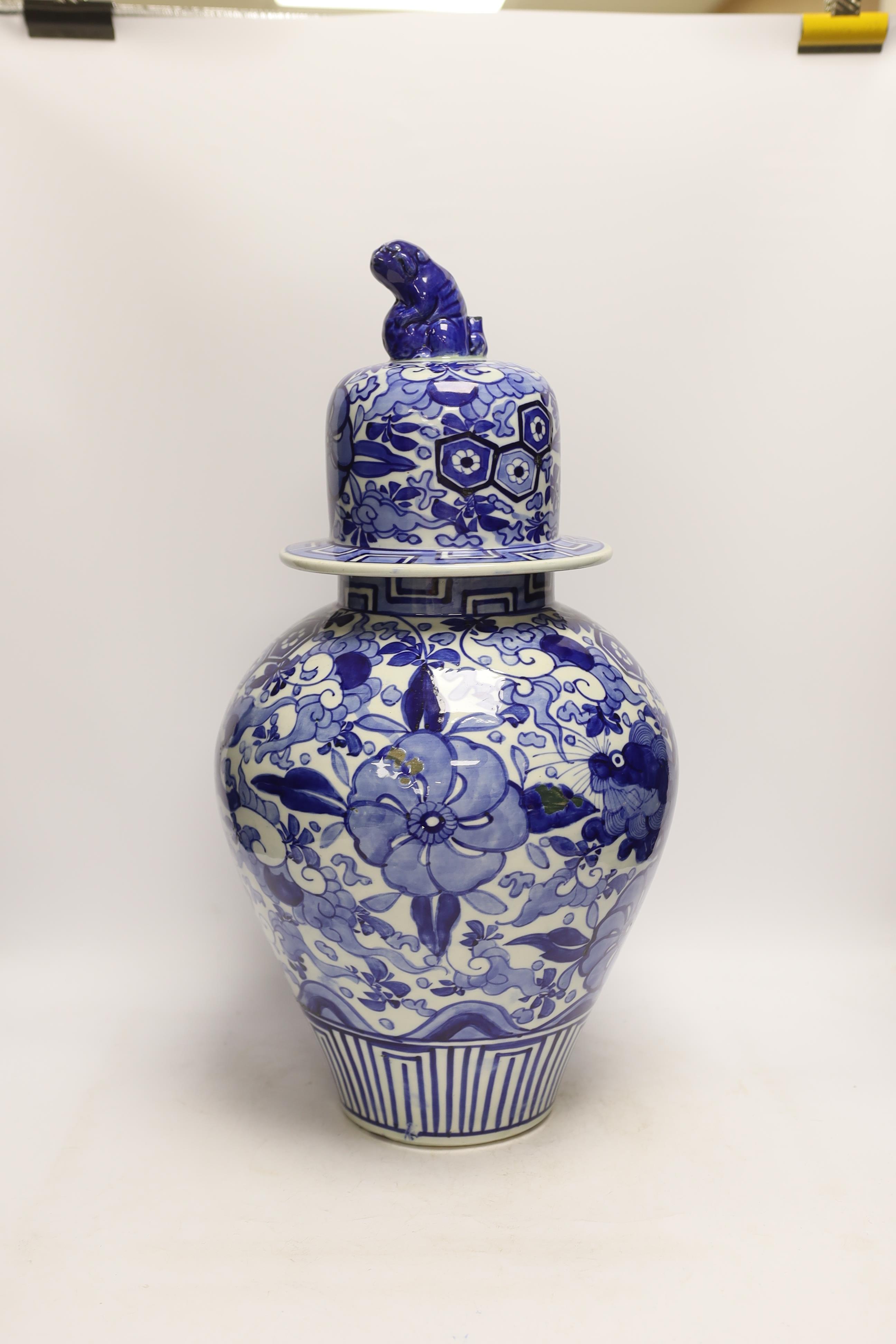 A large Japanese Arita blue and white jar and cover, 54cm